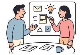 两人白板前交流创意
